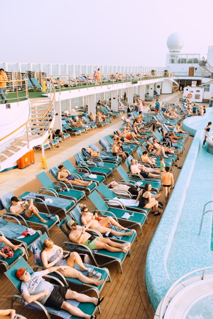 Secrets First Time Cruisers Should Know relaxing by the pool